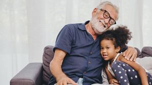 Elderly man with his young grandchild