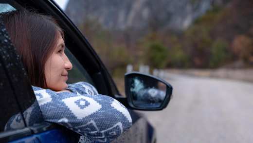 Girl looking out car window
