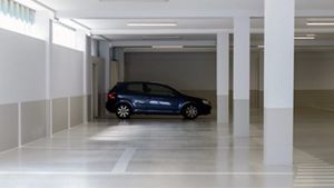 Image of a car parked in an empty underground car park