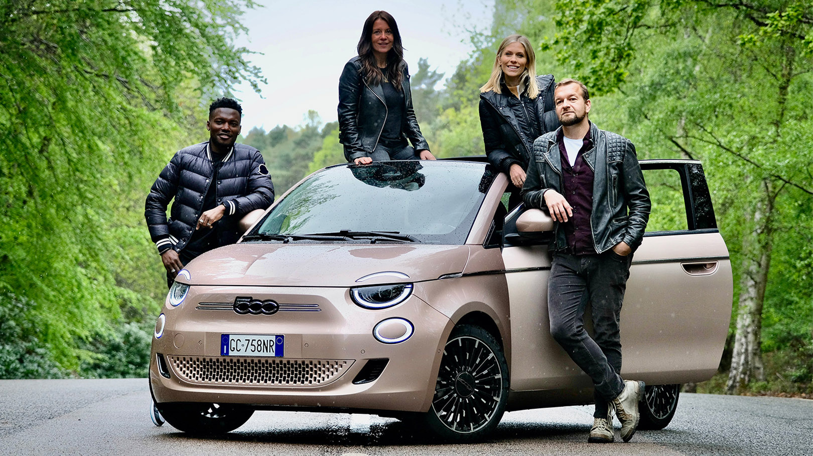 Image of an electric fiat 500 car with four surrounding the car