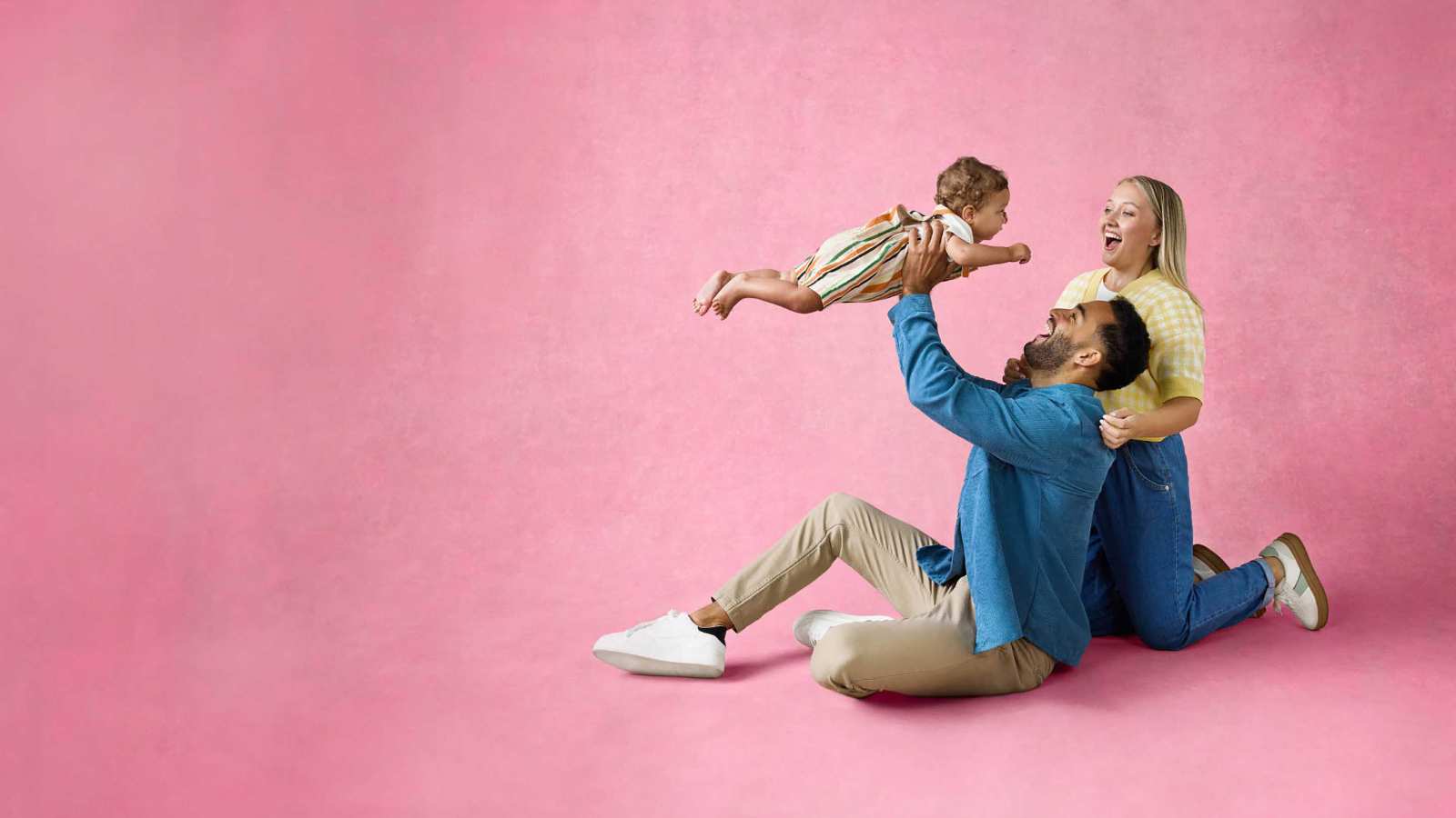 Parents playing with a baby