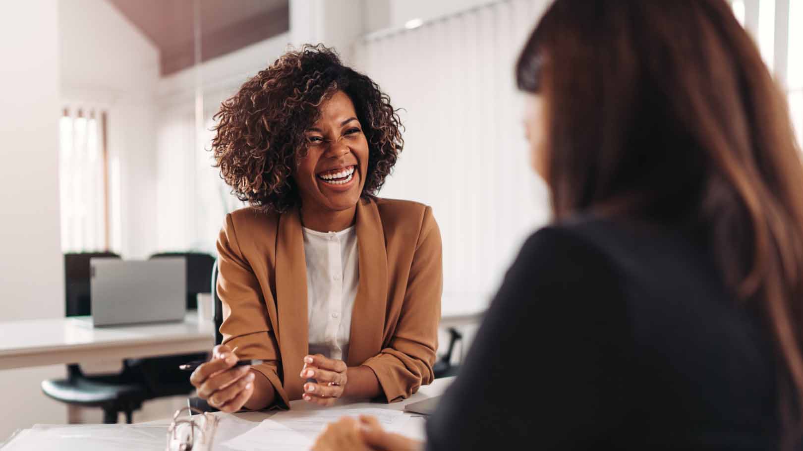 Two people chatting in office