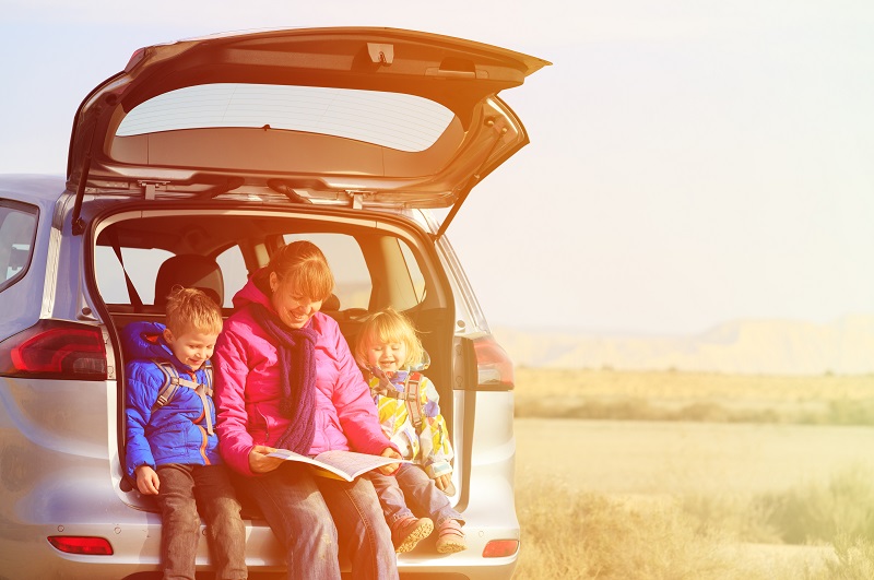 Mum taking a break driving long distances with her kids