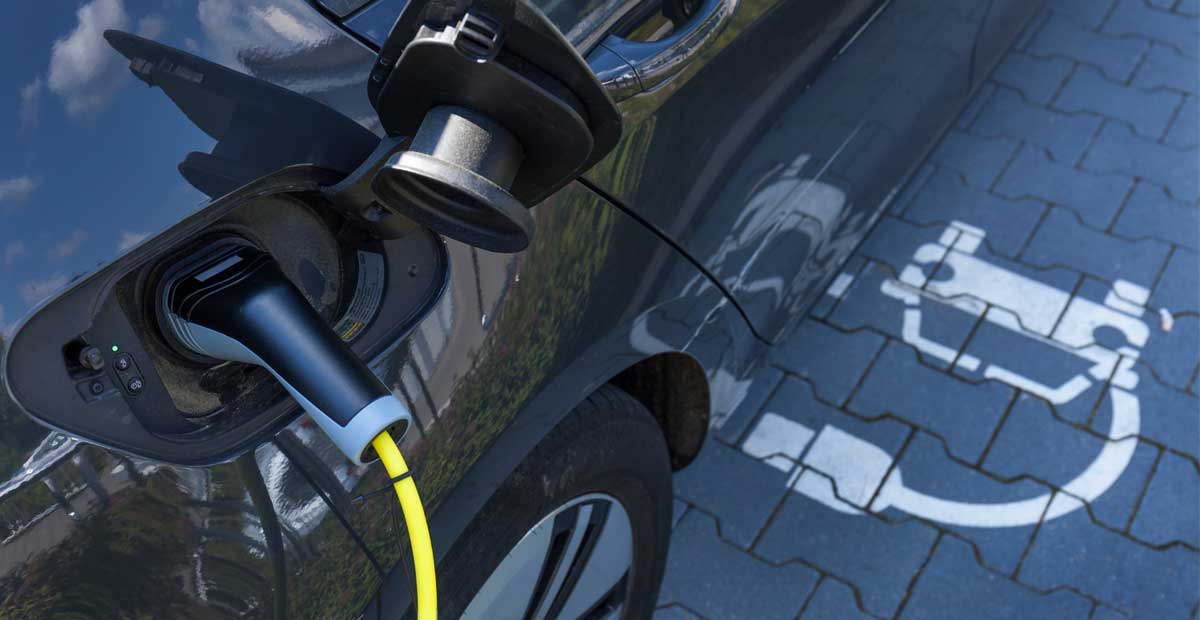 Electric car charging at charging point