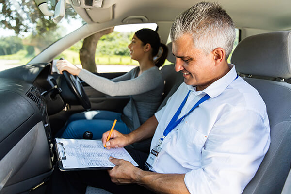 Learning to drive guide - Aviva - Driving instructor in car with female learner driver