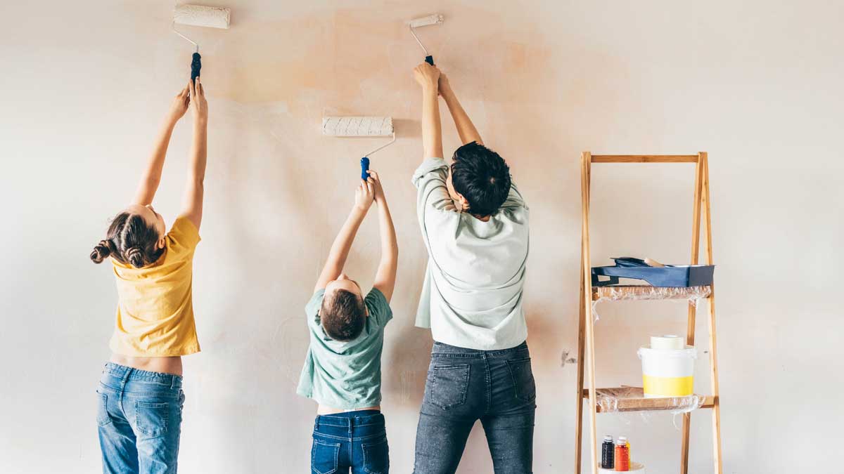 Family painting their house