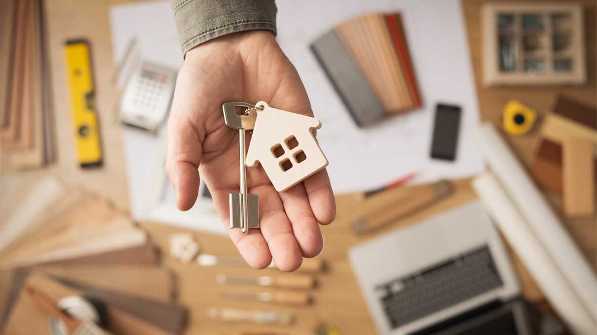 Stamp Duty for first time buyers guide in Ireland – image with hand and keys to new house