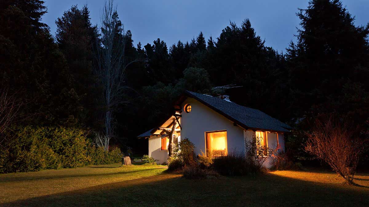 How to keep your house safe from burglars – picture of house at night with lights on
